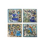 A set of four polychrome decorated Persian tiles, late 19th Century, each moulded in relief and