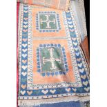 Two Rugs, including a Turkish indigo runner, 3.80m x 0.86m, and a Persian Qashqai, 1.97m x 1.49m.