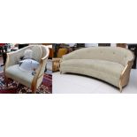 A modern design moon shaped sofa, upholstered in pale sage green, having gilded border, designed