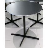 A circular table by Piet Hein, Bruno Mathsson and Arne Jacobsen for Fritz Hansen, with matt black