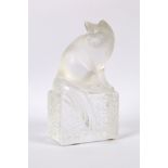 A late 20th Century Lalique glass model of a cat, signed 'Lalique France', on a rectangular base,