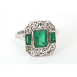 An Art Deco style 18ct white gold, emerald and diamond set dress ring.