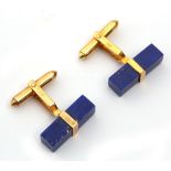 A pair of 14k gold and lapis lazuli cufflinks.