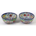 A near pair of Chinese Qing Dynasty Canton enamel bowls for the Middle Eastern market, brightly