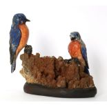 An antique lapidary art carved group, the two kingfishers composed of carved lapis lazuli and