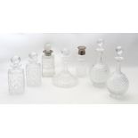 A group of 7 glass decanters / cocktail shakers, one ship's decanter, two globular decanters by