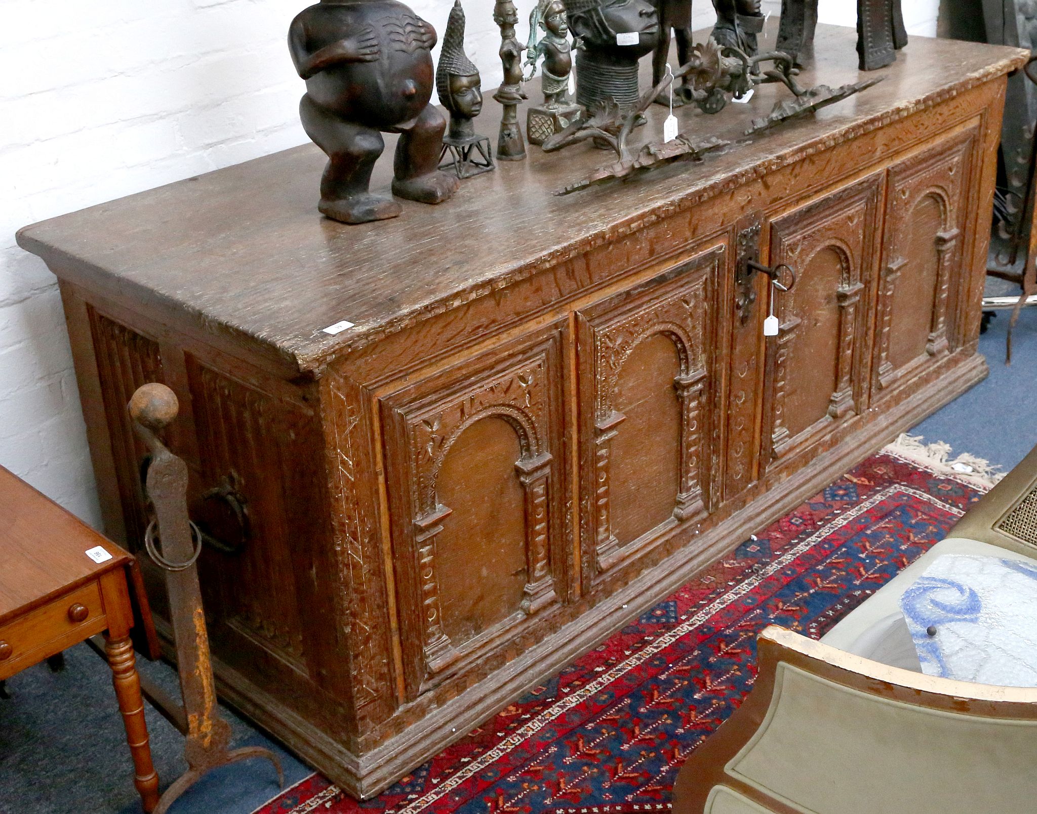A large early 17th Century Danish oak coffer, the long rectangular top moulded with a thumbnail