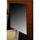 A parquetry framed wall mirror, with antiquated plate, 117 x 70cm.