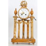 An early 20th century French yellow marble and brass mantle clock, circa 1900-10, with brass