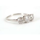 A diamond three-stone ring, Set with brilliant and old brilliant-cut diamonds