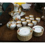 A late 19th / early 20th Century French porcelain 32 piece part tea service, decorated with fruit