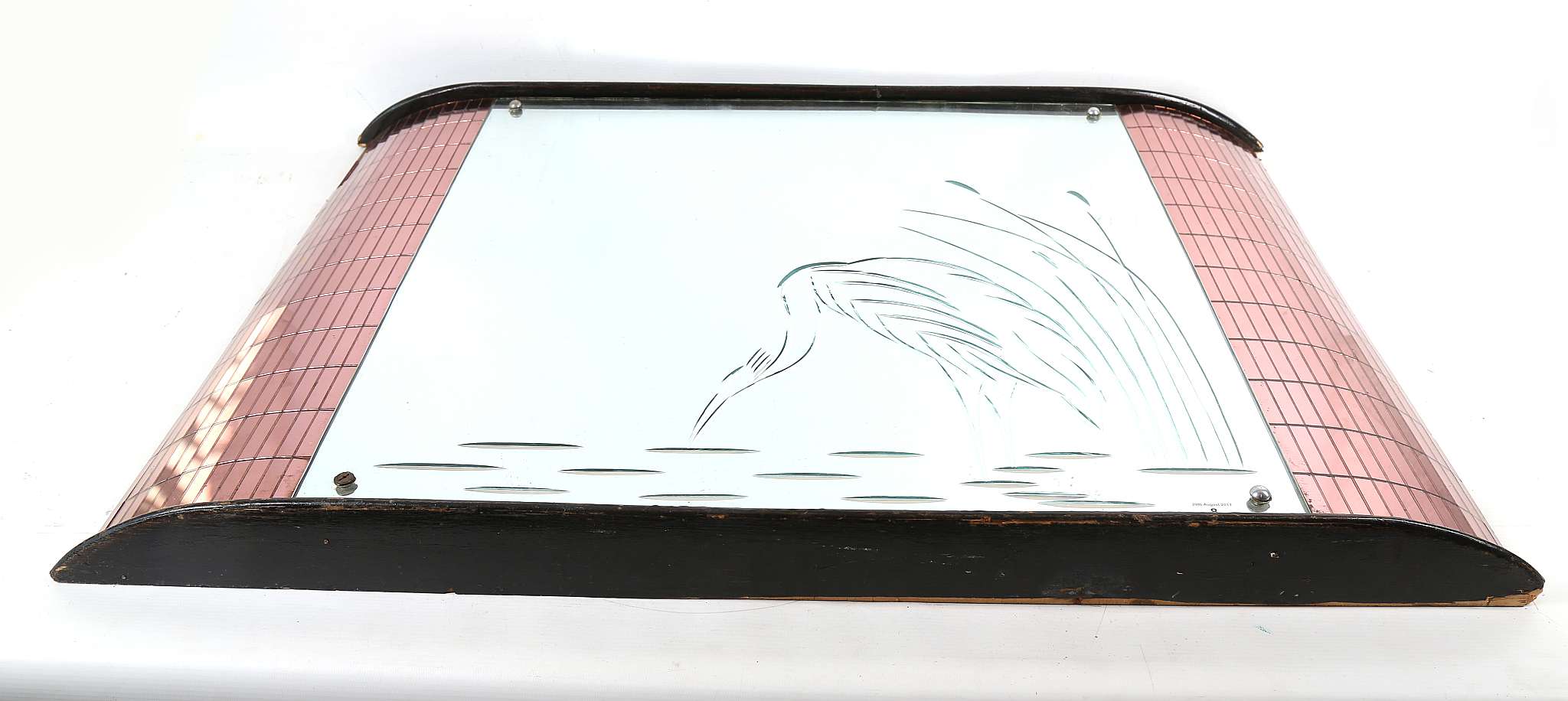 An Art Deco style three section wall mirror, the central plate engraved with a heron, flanked by