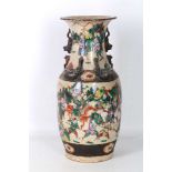 A late 19th Century Chinese baluster base, crackle glaze decorated with battle scenes and having