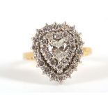 An 18ct yellow gold, diamond heart shaped cluster ring, the central stone approx .75ct.