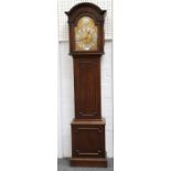A 1920's oak grandmother clock with arched brassed dial and silver chapter ring, marked Arabic