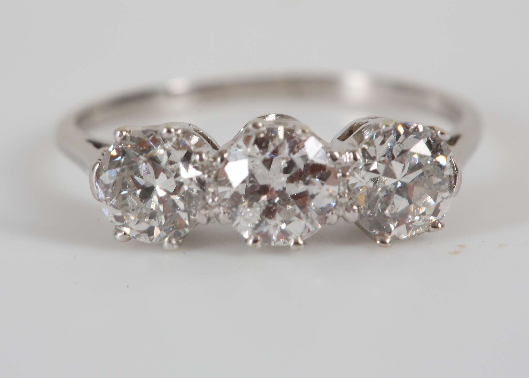 A diamond three-stone ring, Set with brilliant and old brilliant-cut diamonds - Image 2 of 2