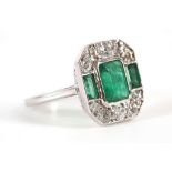 An Art Deco style 18ct white gold, emerald and diamond ring, of octagonal plaque form.