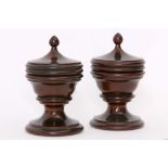 A pair of antique Lignum Vitae turned covered pots.