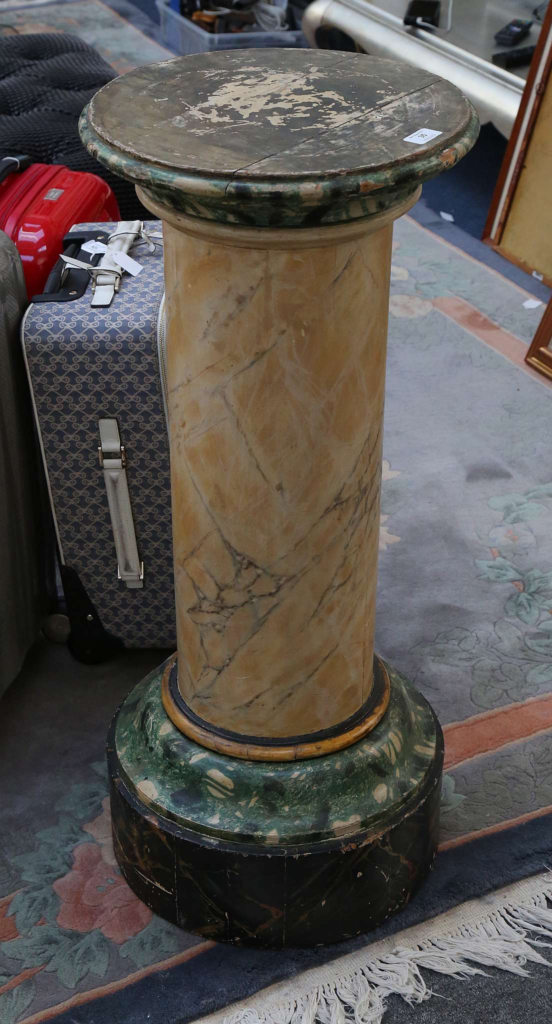 An early 20th Century painted faux marble column, on circular base, 92cm high.