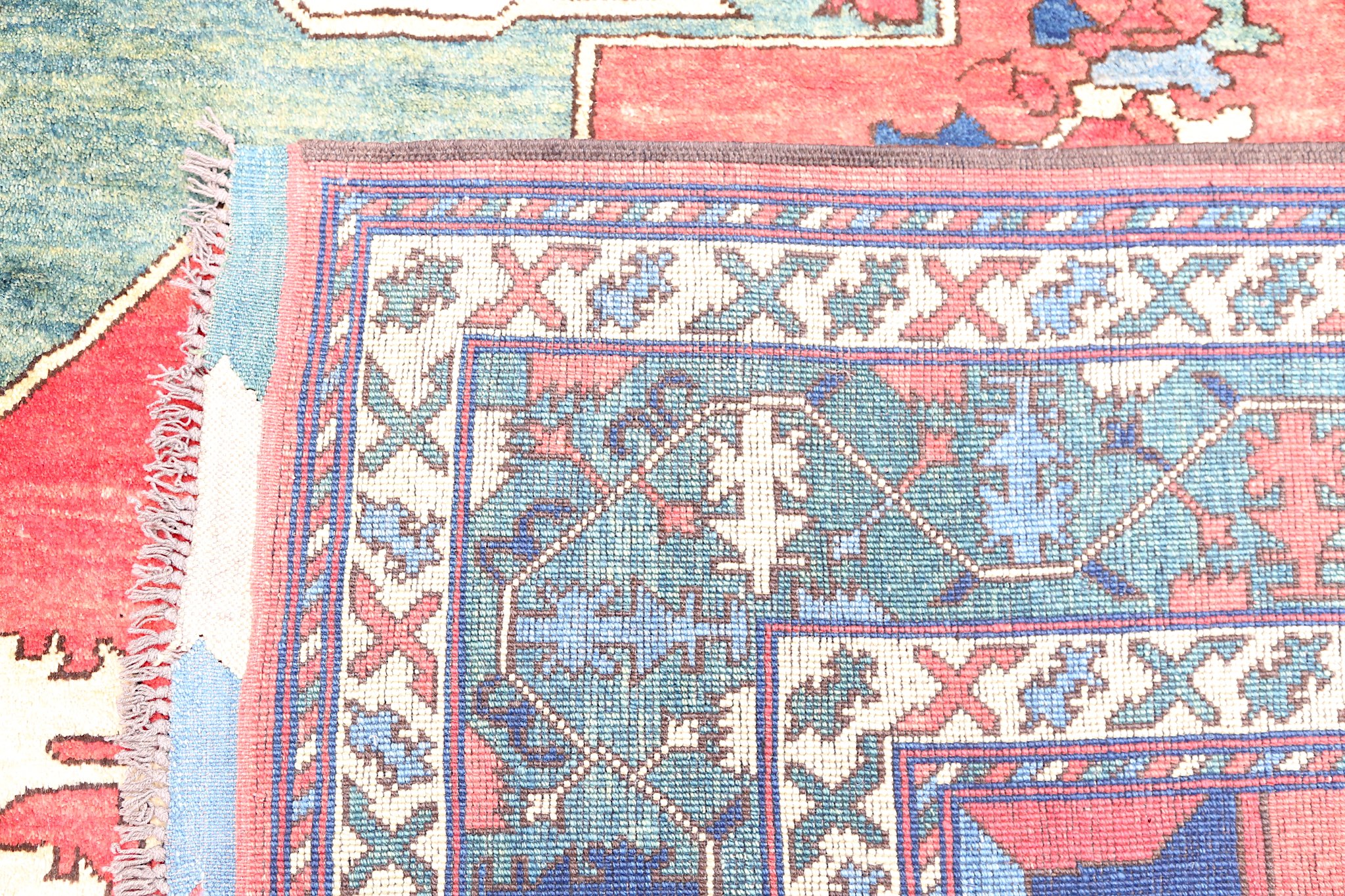 A FINE UZBEKISTAN CARPET approx: 11ft.3in. x 9ft.8in.(342cm. x 294cm.) The soft light red field with - Image 5 of 5