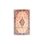 AN USHAK CARPET, TURKEY approx: 10ft.6in. x 7ft.1in.(320cm. x 215cm.) The beige field with angular