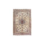 A SIGNED KIRMAN CARPET SOUTH PERSIA, CIRCA 1910 approx; 11ft.1in. x 8ft.3in.(337cm. x 251cm.) The