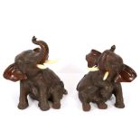 A pair of Japanese bronze model of baby elephants with ivory tusks, 19th Century, signed Omori