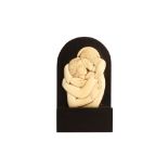 ERIC GILL A.R.A. (1882-1940). 'Lovers Embrace'. Circa 1920. Fine ivory carving set on an ebony
