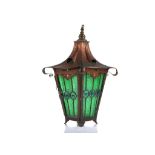 AN ARTS AND CRAFTS COPPER HANGING LANTERN, of square form, with ripple green panels and bulls eye