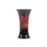 A WILLIAM MOORCROFT POTTERY VASE OF OVOID FROM, tube-lined with pomegranate and berry's, with