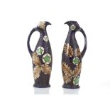 A PAIR OF ART NOUVEAU BOHEMIAN AMPHORA PORCELAIN EWERS, of highly organic form, applied with