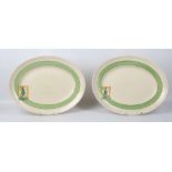 PAIR OF CLARICE CLIFF BIZARRE STROUD PATTERN MEAT PLATES, 1930s, of oval form, painted with