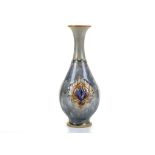 AN EARLY 20TH CENTURY ROYAL DOULTON ART NOUVEAU STONEWARE SLENDER BALUSTER SHAPED VASE BY HAYWARD E.