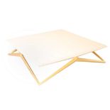 A LARGE MODERN WHITE GLOSS COFFEE TABLE, on gold leaf 'X' base, (139.5 x 139.5 x 35cm high)