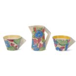 CLARICE CLIFF FANTASQUE BIZARRE, BLUE CHINTZ PATTERN, conical milk jug and two coffee cups,