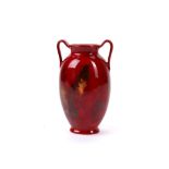 CHARLES NOKE FOR ROYAL DOULTON, an early 20th century flambe twin handled, amphora shape vase,
