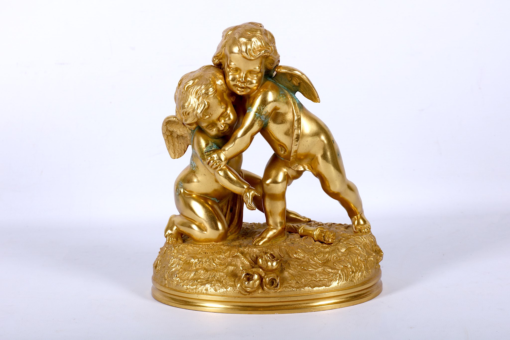 A 19th Century ormolu figural group of Cupid & Psyche on a naturalistic base, signed Cumberworth.