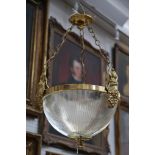 A pair of Edwardian hanging ceiling lights having deep clear reeded bowl, supported by gilt bands,