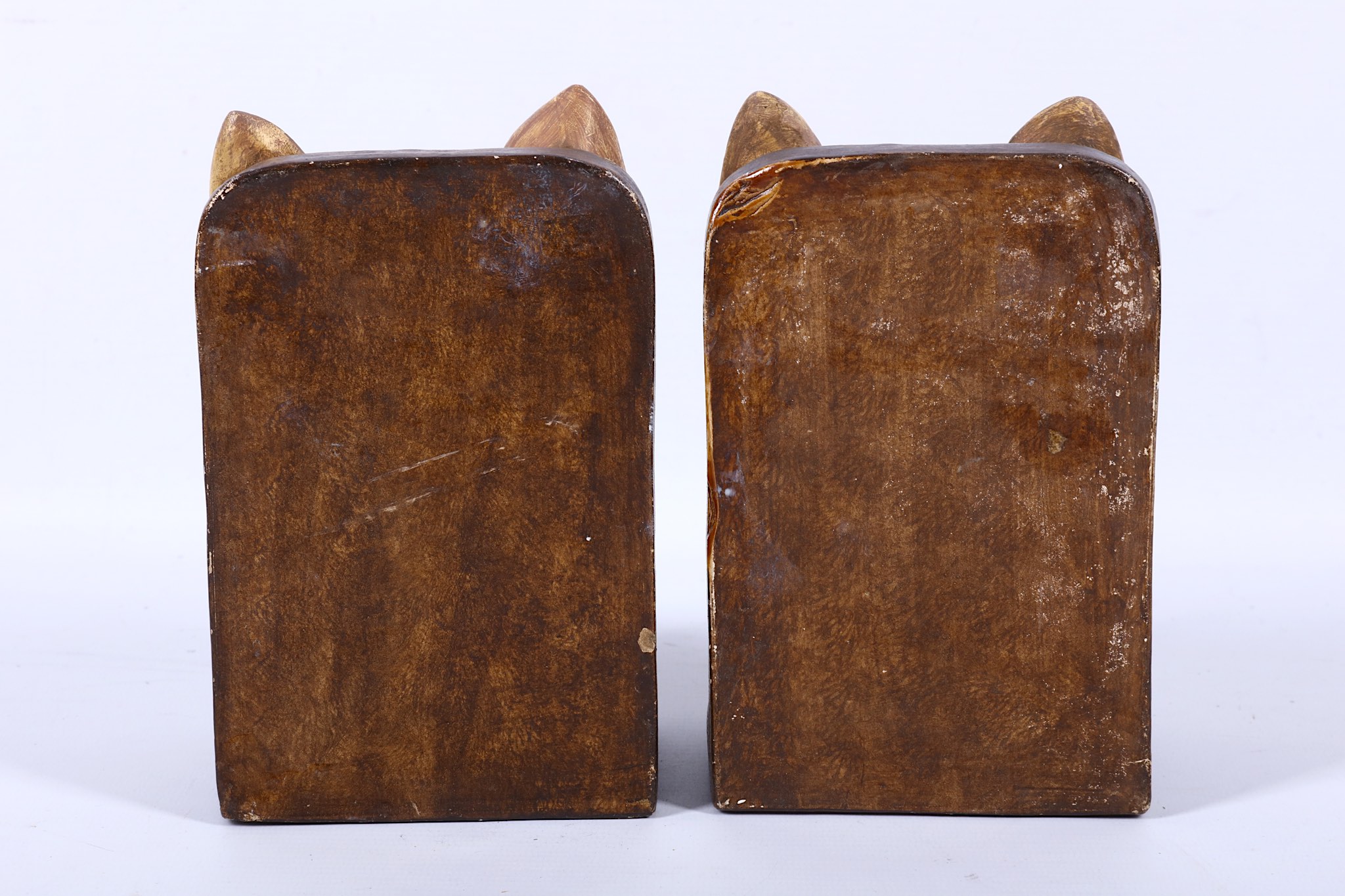 Compton pottery, a pair of unusual book-ends modelled as dogs, in light brown semi-matt glazes, c. - Image 2 of 2