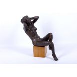 After Henry Moore, a mid 20th Century plaster model of a seated female nude, bronze patinated,