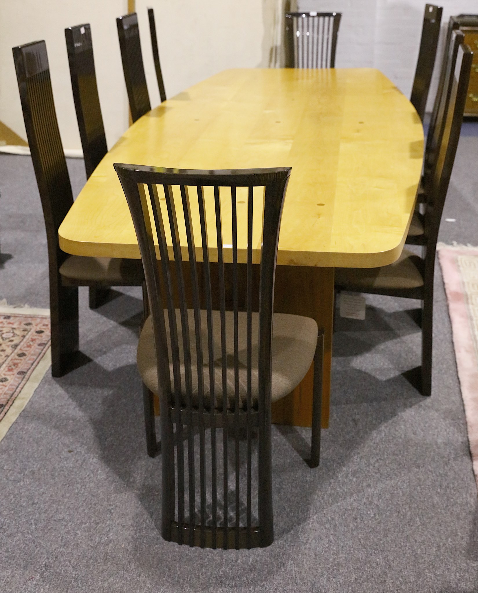 A CONTEMPORARY BESPOKE DINING TABLE, produced by Moir Wade Design Ltd. with sycamore top on black