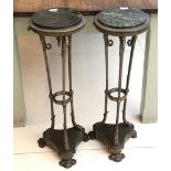 A pair of bronze and marble topped empire style guiderons, 79cm high.