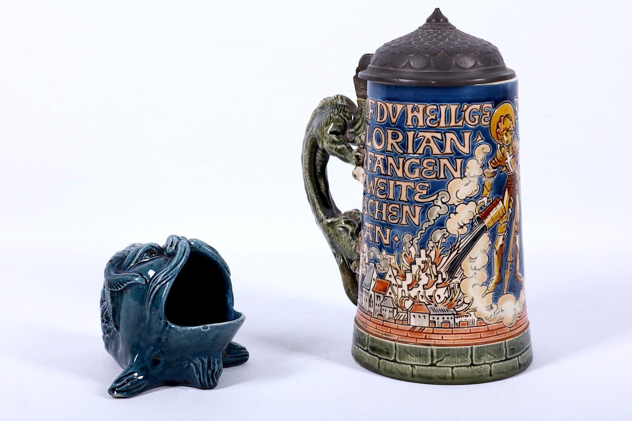 A good early 20th Century Mettlach pottery stein moulded with Gothic landscape view, and an Austrian