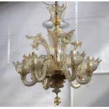 A mid 20th Century Venetian 6 branch glass chandelier, with scrolling arms and basket drip pans.