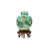 A CHINESE  ENAMELLED ‘CRANE AND LOTUS’ MOULDED JAR AND COVER. 19th / 20th Century. Decorated in
