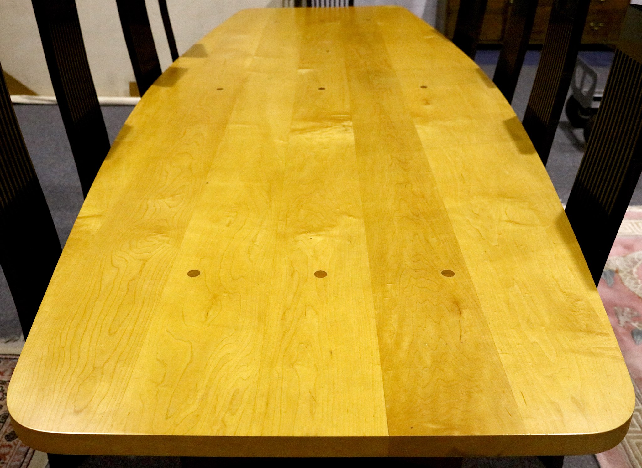 A CONTEMPORARY BESPOKE DINING TABLE, produced by Moir Wade Design Ltd. with sycamore top on black - Image 2 of 3