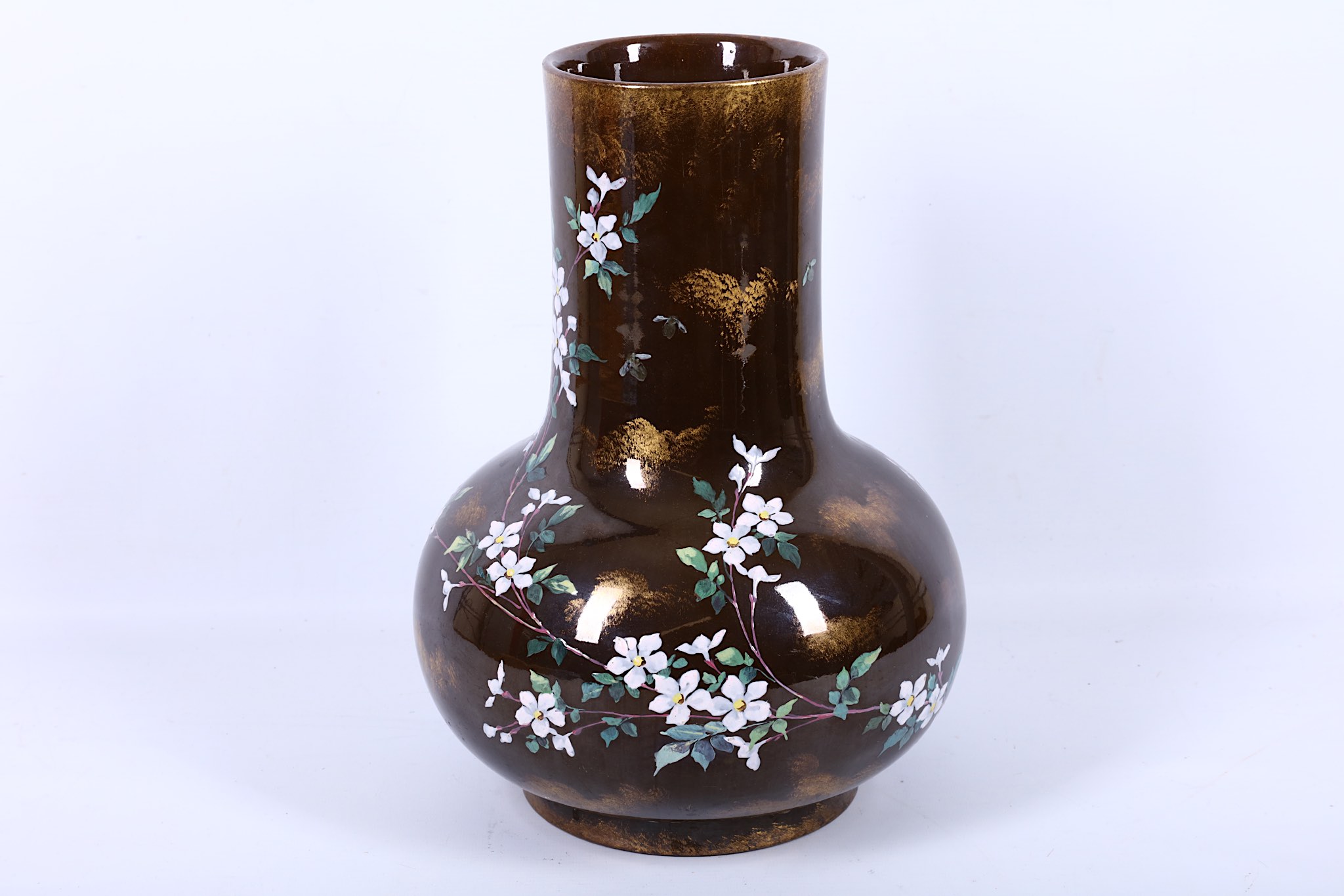 An early 20th Century Japanese earthenware baluster shaped vase, enamelled with early spring