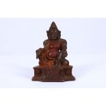 A late 19th / early 20th Century brass and copper Sino-Tibetan statue of a deity, in seated