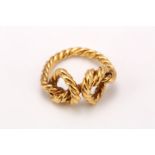 A gold knot ring, The 18 carat gold ropetwist ring featuring two knots, UK hallmark