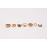 A collection of rings, Including a 9 carat gold signet ring, a gold band ring, a CZ single-stone